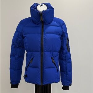 SAM. Vibrant Blue and Black jacket.